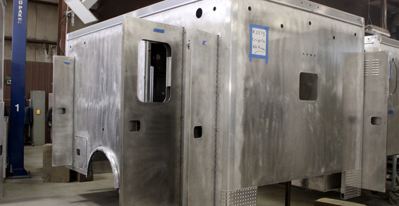 Custom Truck and Body Works, Inc. Type I ambulance for Crisp #2579 shown from the front curbside corner in welding and fabrication.
