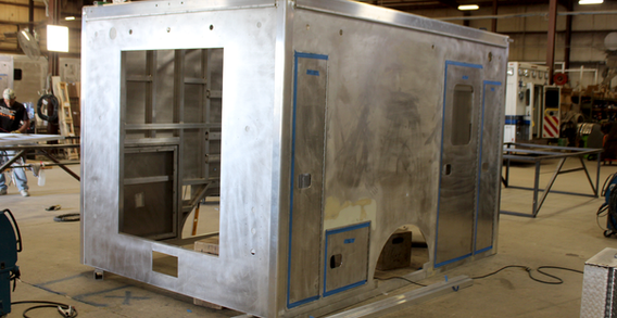 Rear curbside view of Calhoun #2662 in beginning welding and fabrication.