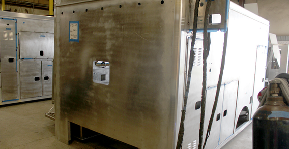 Front driver side corner view of NEFEA #2663 in beginning welding and fabrication. Type I ambulance fabrication.