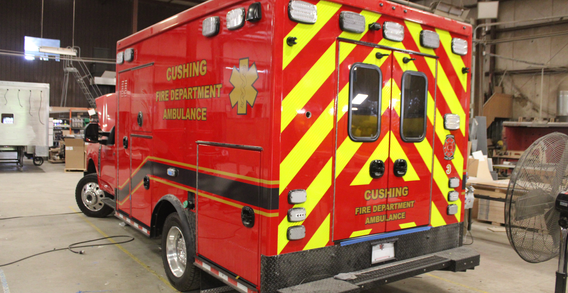 Rear driver side corner view of Cushing #2584 Type I ambulance in electrical.