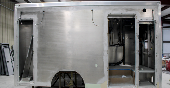 Curbside view of Butts #2613 in paint and body prep.