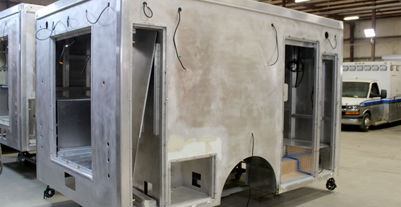 Rear curbside corner view of Calhoun #2662 in welding and fabrication.