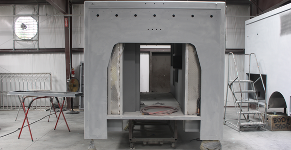 Front view of Muskogee #2654 in paint and body prep. Type III ambulance primed and sanded.