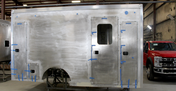 Curbside view of EVO Stock Type I ambulance #2547 in welding and fabrication.