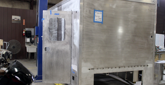 Front curbside corner view of GA. Comm. of Ins. #2619 command unit in welding and fabrication.