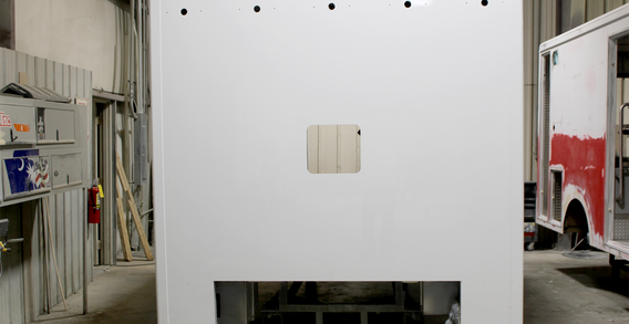 Front wall view of a white Type I ambulance.
