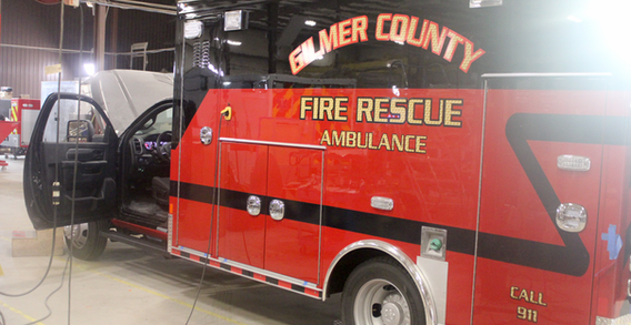 Rear driver side corner of red and black truck for Gilmer #2695 in electrical.