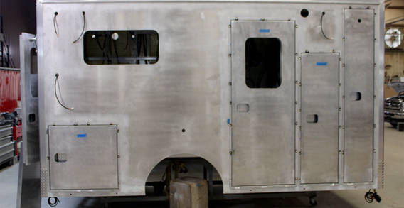 Curbside view of Muskogee #2656 Type III ambulance in welding and fabrication.