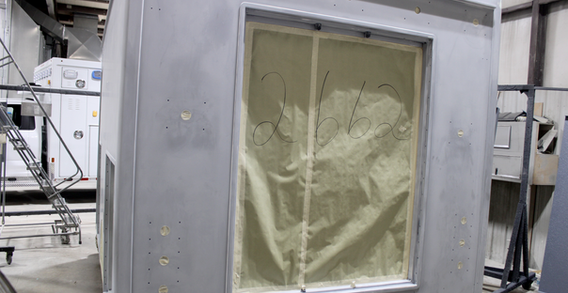 Rear wall view of Type I ambulance in paint, papered for final painting.