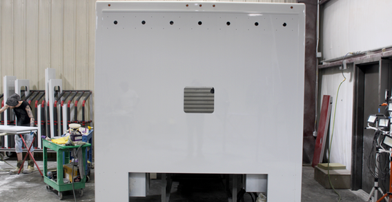 Front wall view of Type I ambulance with pass through cutout, painted white. Calhoun #2662 ambulance.