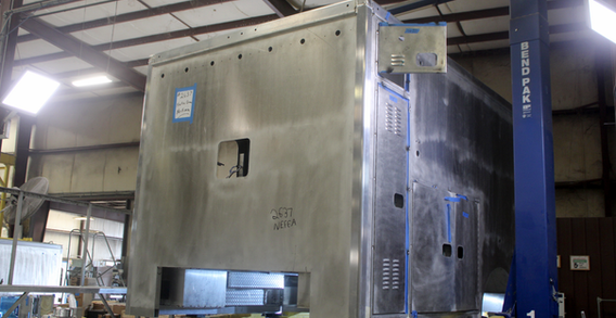Front driver side corner view of NEFEA #2637 on welding and fabrication lift.