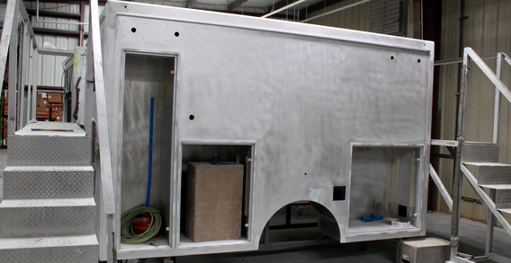 Driver side view of Calhoun #2622 Type I ambulance from Custom Truck and Body Works, Inc. Woodbury Ga. Shown from the driver side in paint and body prep.