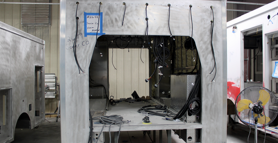 Front wall view of Type III ambulance in prime prep.