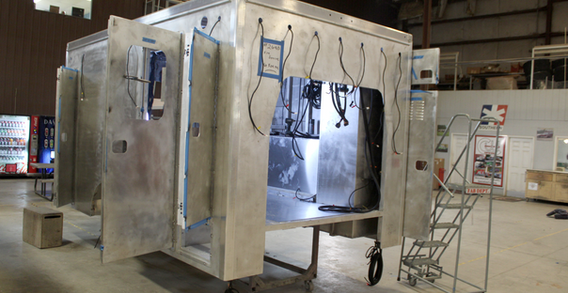 Type III metal ambulance in welding and fabrication shown from front curbside angle for Fire Service #2690