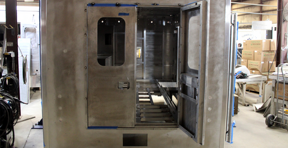 Rear wall view of Monroe #2647 on welding and fabrication lift.