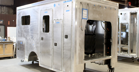 Front curbside corner view of Type III ambulance for Muskogee #2657 in welding and fabrication.