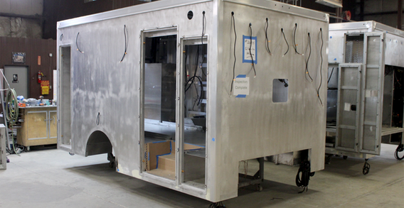 Front curbside corner view of Gilmer #2695 in welding and fabrication.