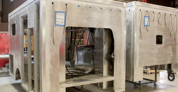 Front curbside corner view of Type III Muskogee #2657 ambulance in welding and fabrication.