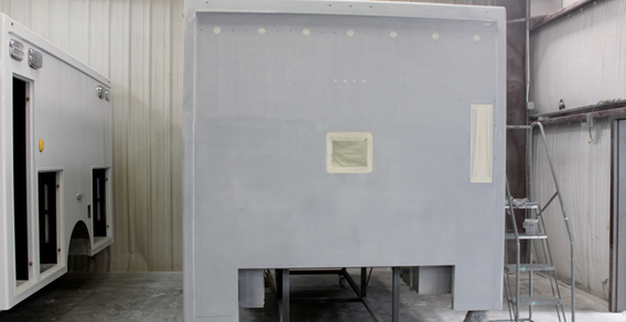 Front wall view of Cushing #2584 in paint and body prep. Type I ambulance.