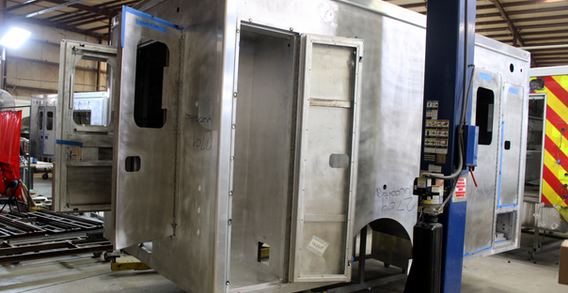 Rear curbside corner view of Woodford #2709 in welding and fabrication.