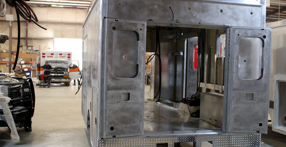 Rear wall view of Muskogee #2653 in welding and fabrication. Type III ambulance from Custom Truck and Body Works, Inc.
