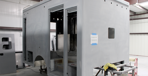 Front curbside corner view of Candler #2635 in paint and body prep.