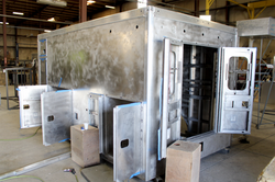 Rear driver side corner view of Atlantic #2604 in beginning stages of welding and fabricati