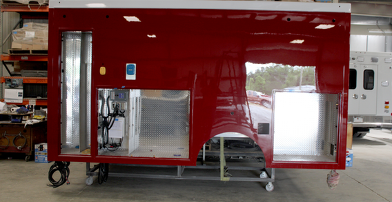 Driver side view of Type I ambulance for Monroe Ga in paint.
