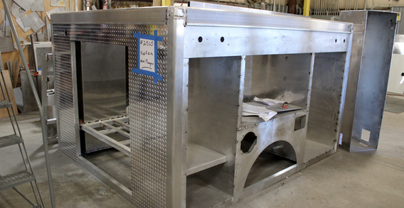 Front driver side corner view of NEFEA #2565 in welding and fabrication.