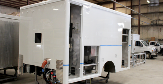 Front driver side corner view of Screvens #2660 with paint tape for red paint.