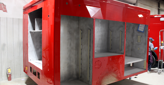 Rear curbside corner view of Hwy 58 #2569 painted red.