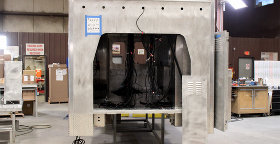 Front view of Harrison #2677 in welding and fabrication. Front view of a Type III ambulance being made.