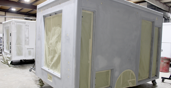 Rear curbside corner view of Calhount #2662 Type I ambulance in paint.