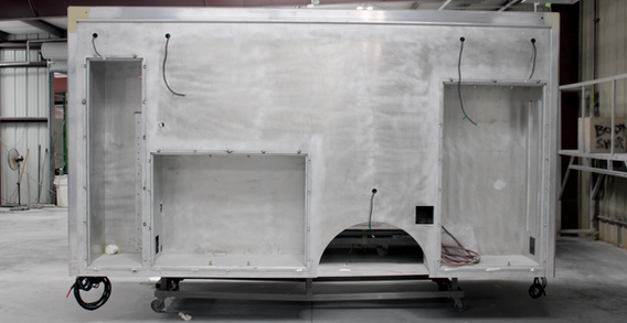 Driver side view of Type I ambulance for Fire Service #2689 in paint and body prep.
