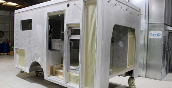 Front curbside corner view of Type III ambulance for Muskogee #2654