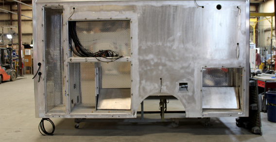 Driver side view of Muskogee #2656 in welding and fabrication. Type III ambulance shown from Driver side in welding and fabrication process.