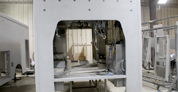 Front wall view of Sevier Co. #2701 in paint and body prep. Type III ambulance primed and getting ready for paint.