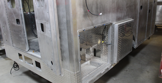 Rear lower curbside corner compartment with diamond plate for Muskogee #2658.