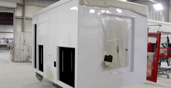 Rear driver side corner view of EVO #2586 painted white.