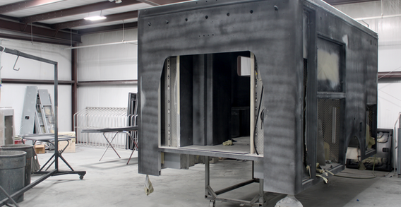 Front driver side corner view of Muskogee #2655 in paint and body prep.