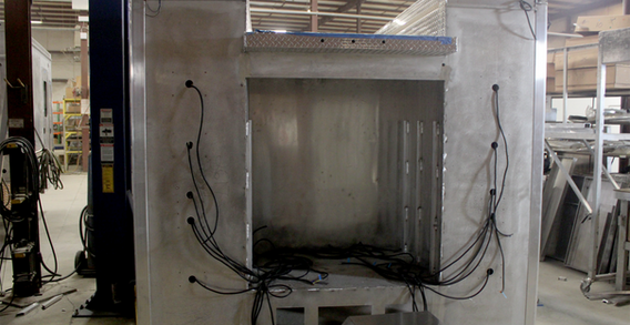 Rear wall view of Forsyth NC #2617 on welding and fabrication lift.