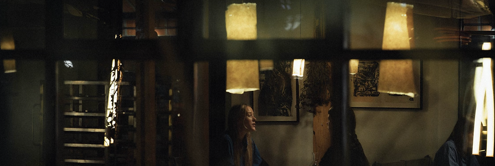 woman having a private conversation behind a window