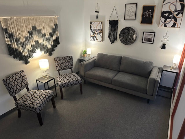 Eye-level view of a quiet room with a comfortable chair and soft lighting for a therapy session