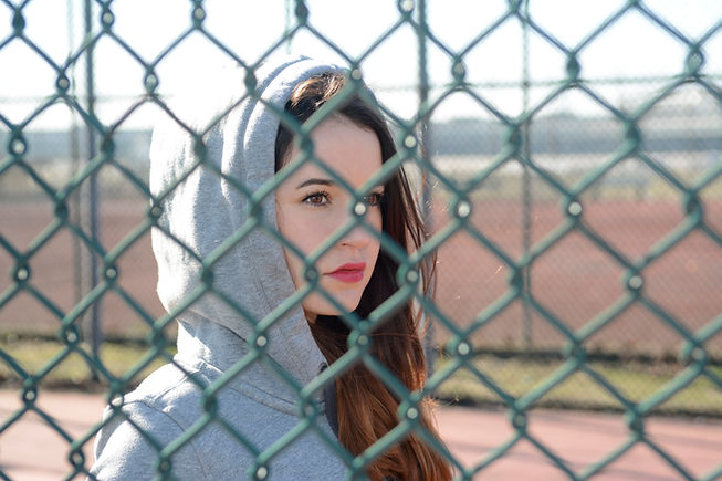 Woman Behind Fence