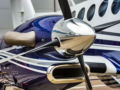 Closeup high detailed view of engine and airscrew of modern turboprop airplane standing on