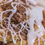 Thumbnail: Close-up of a cinnamon roll with white icing and brown sugar.