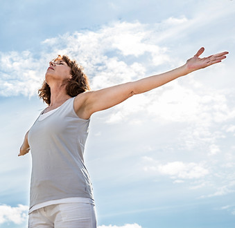 Woman with arms wide open
