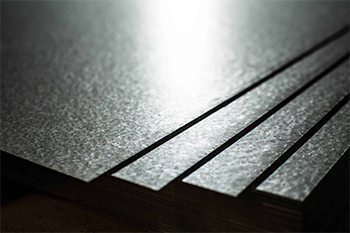 Close-up view of stacked Galvalume® steel sheets.