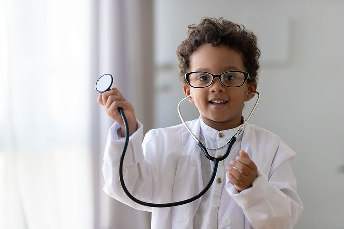 Cute small african american kid boy wear medical uniform glasses holding stethoscope playi