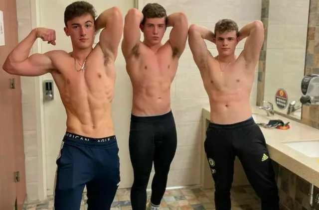 young muscular jock flexing gym locker room